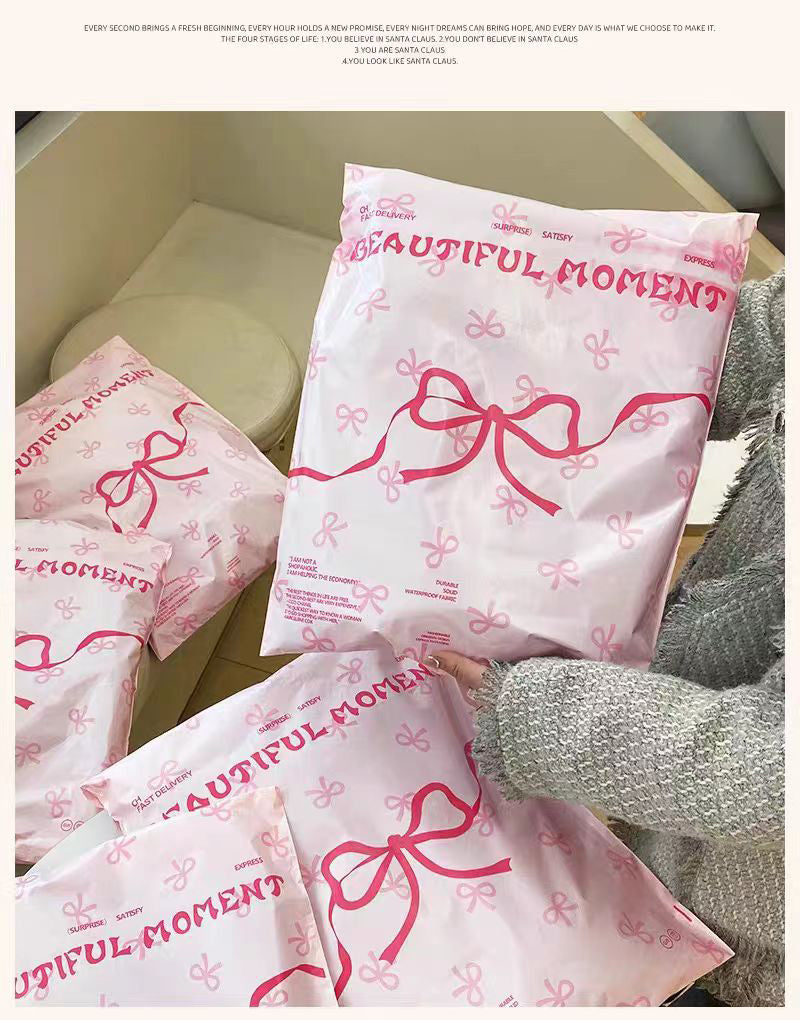 Pink bow-tie express delivery bag, clothing packaging bag, express delivery packing bag, thickened colorful express delivery bag wholesale.