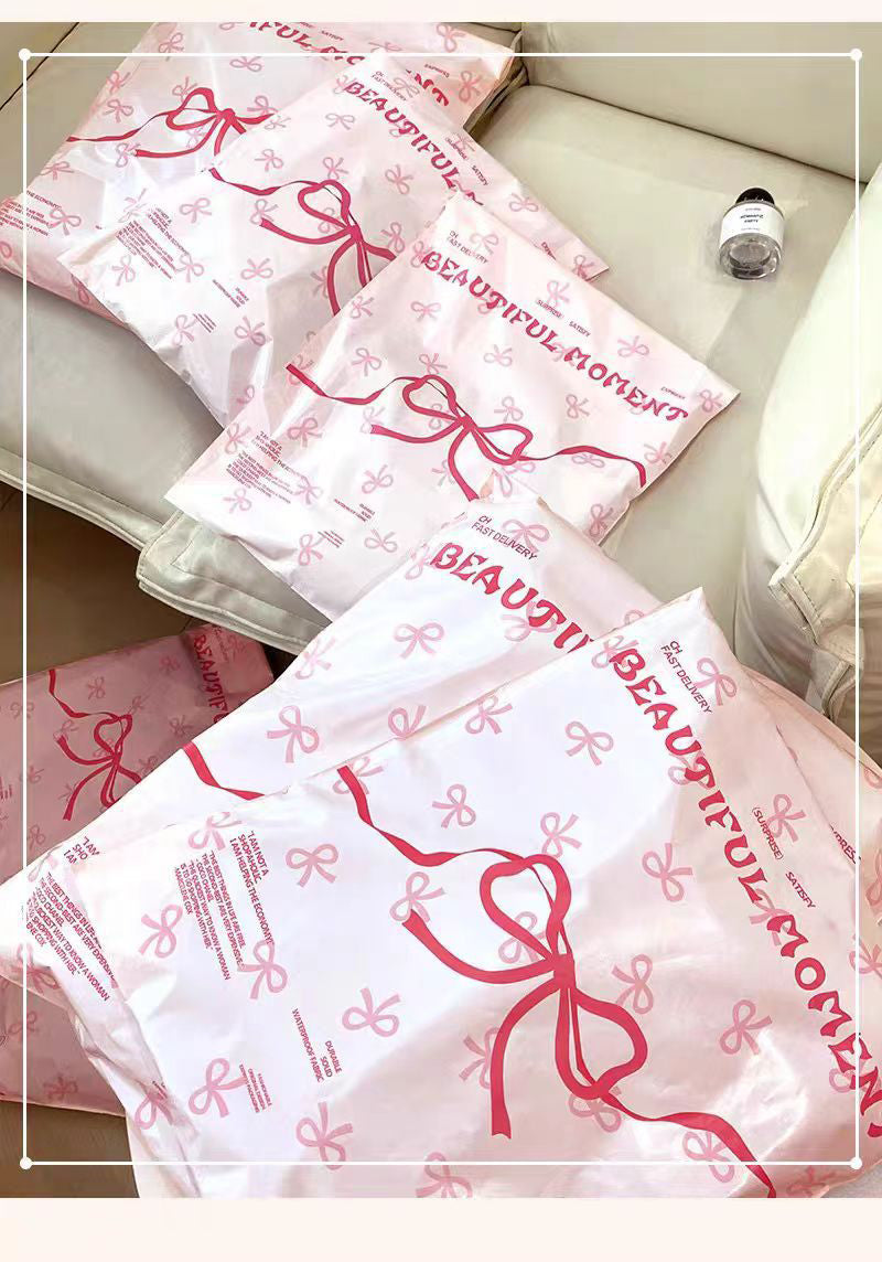 Pink bow-tie express delivery bag, clothing packaging bag, express delivery packing bag, thickened colorful express delivery bag wholesale.