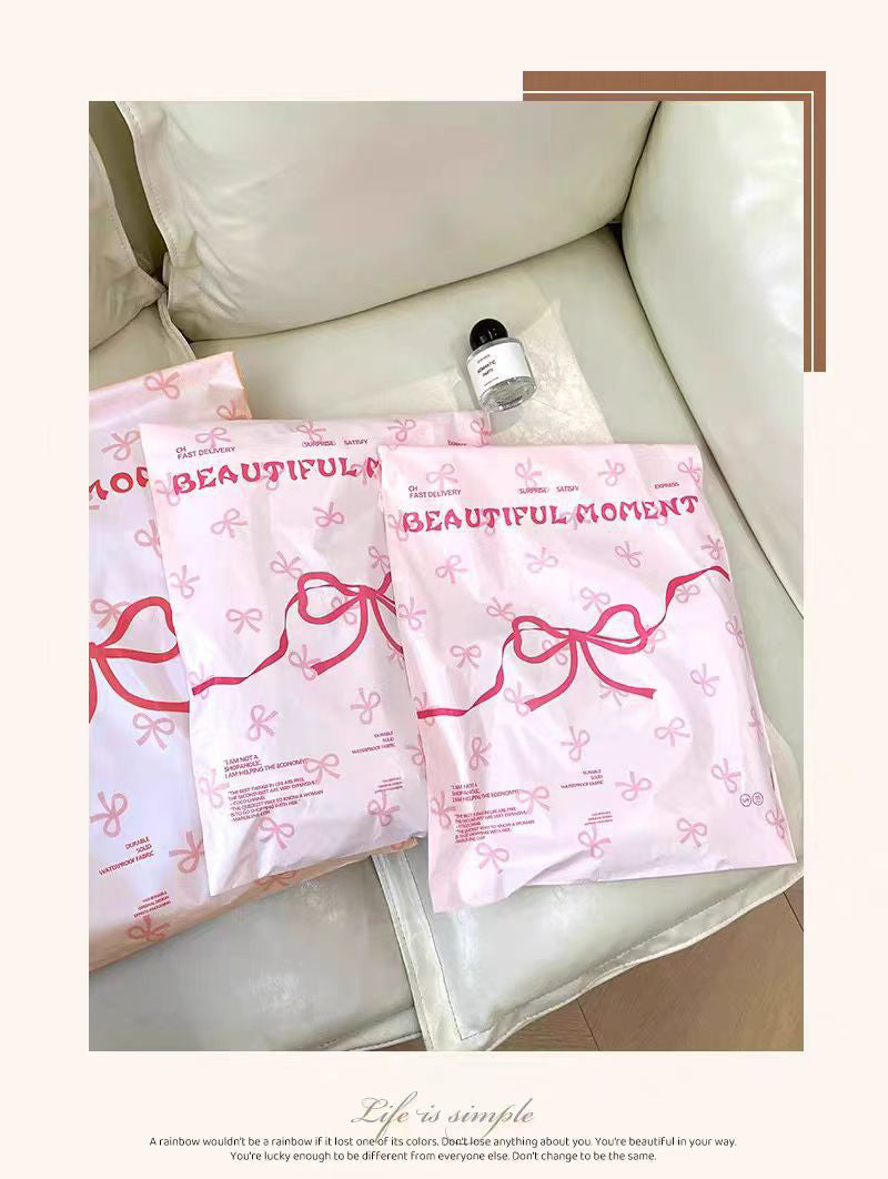 Pink bow-tie express delivery bag, clothing packaging bag, express delivery packing bag, thickened colorful express delivery bag wholesale.