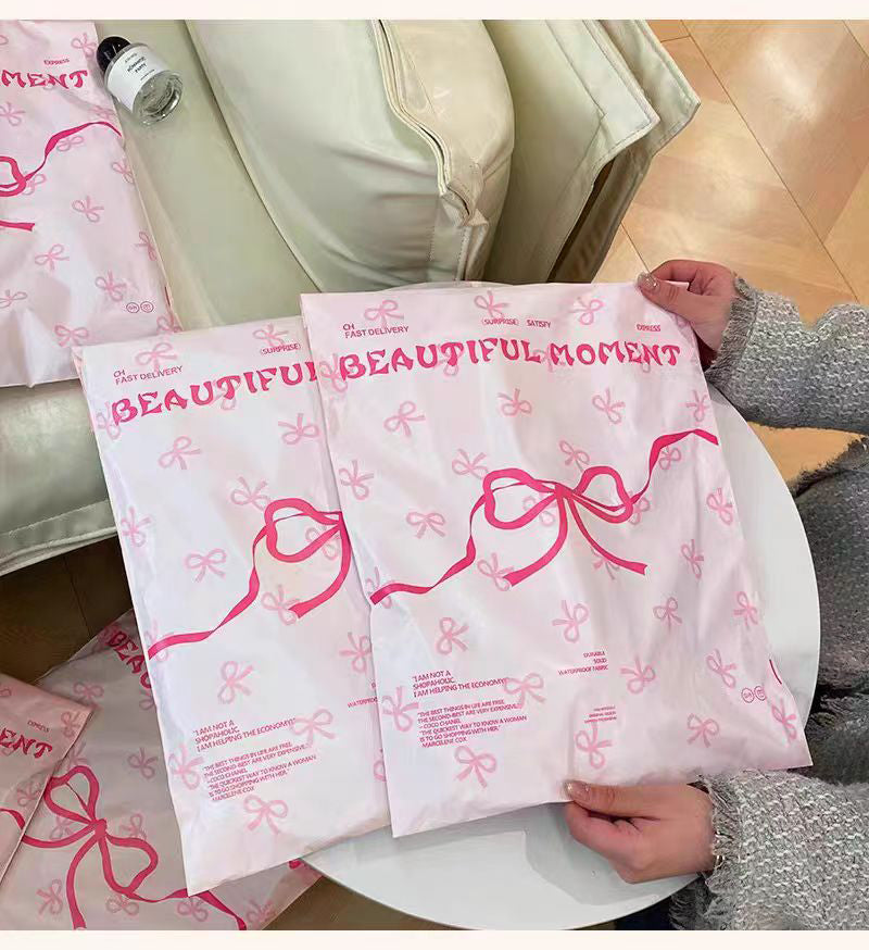 Pink bow-tie express delivery bag, clothing packaging bag, express delivery packing bag, thickened colorful express delivery bag wholesale.