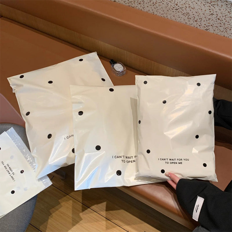 Pink bow-tie express delivery bag, clothing packaging bag, express delivery packing bag, thickened colorful express delivery bag wholesale.