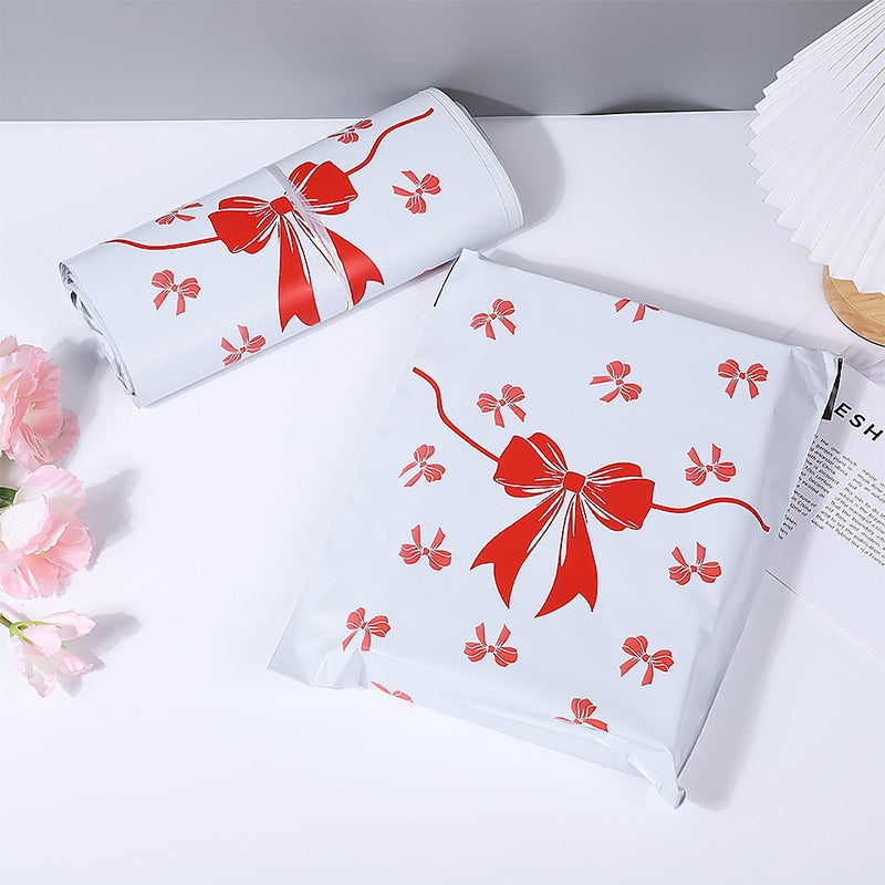 Pink bow-tie express delivery bag, clothing packaging bag, express delivery packing bag, thickened colorful express delivery bag wholesale.